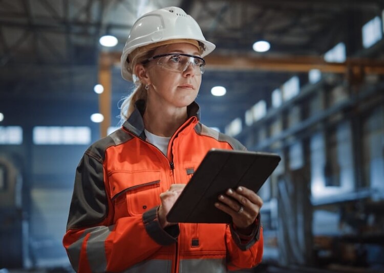 A female engineer in high-vis protective gear