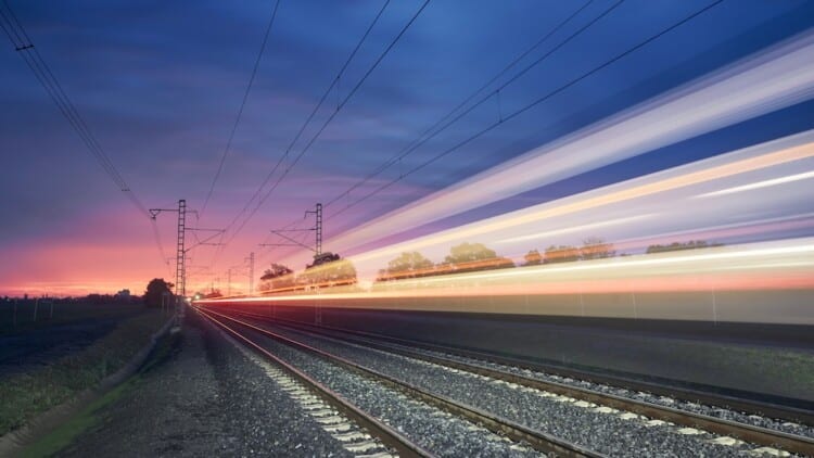 Light trail of high speed train on railroad track