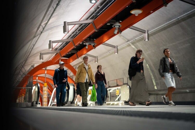 Commuters in the metro tunnel.